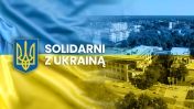 Urząd Miasta Legionowo na tle flagi Ukrainy, napis: Solidarni z Ukrainą, obok herb Ukrainy