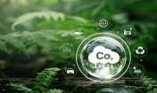 Grafika z chmurką - w niej symbol CO2 - obok różne symbole ekologiczne