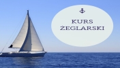 Żaglówka i napis kurs żeglarski