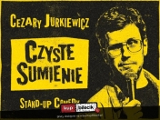 plakat czarne tło, po lewej stronie opis wydarzenia w kolorze żółtym, po prawej zdjęcie jurkiewicza żółta grafika
