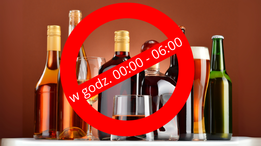 butelki alkoholu, na pierwszym planie znak zakazu i napis w godz. 00:00 do 06:00
